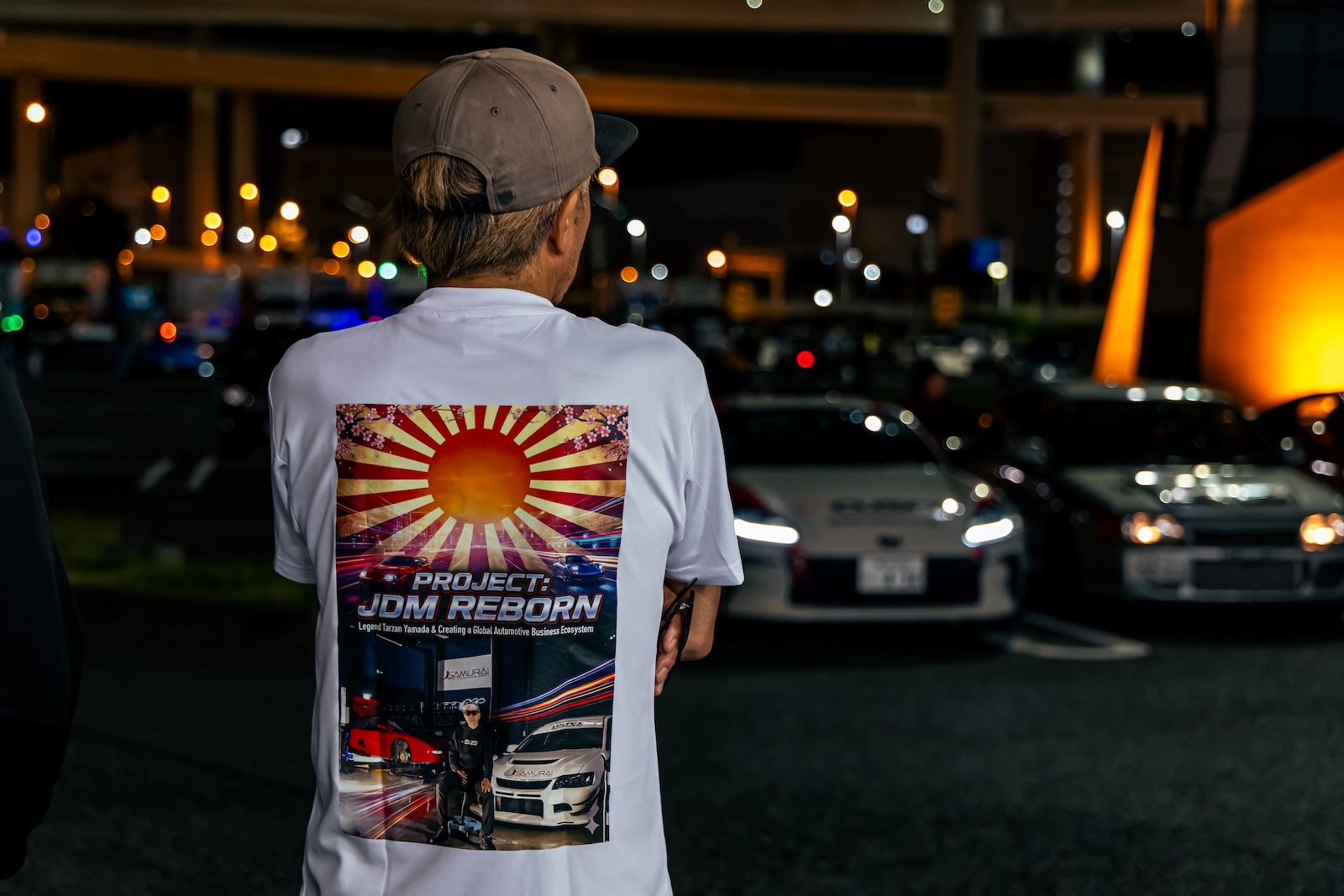 Tarzan Yamada beside a JDM car in Yokohama