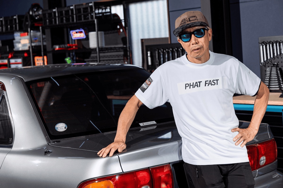 TARZAN YAMADA beside a JDM car in the SAMURAI garage